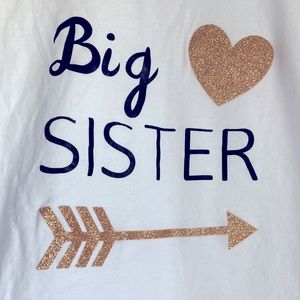 Big Sister T-Shirt Black Lettering with Gold Glitter Arrow and Heart.